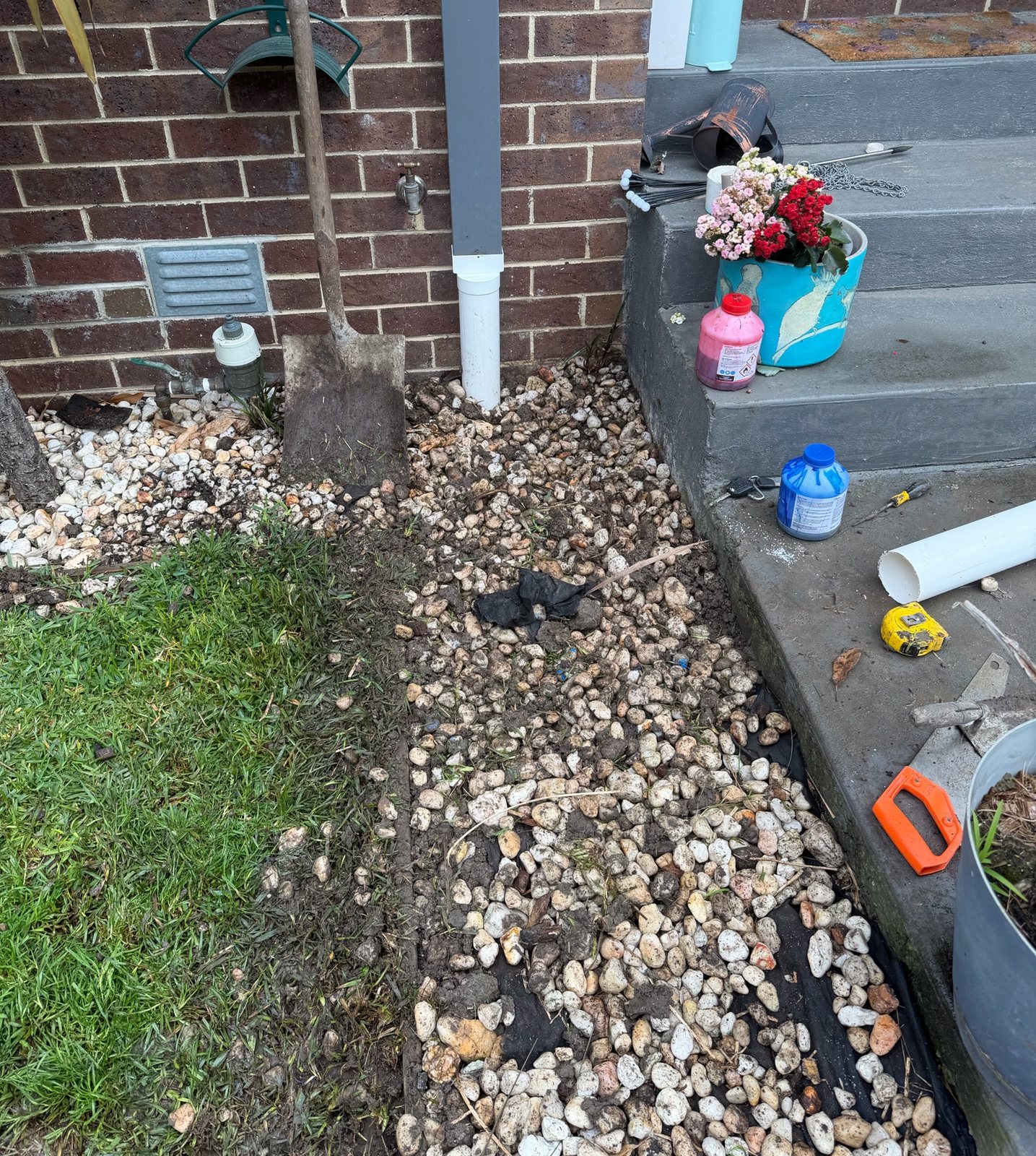 Downpipe and excavated stormwater route during repair work in Brunswick West