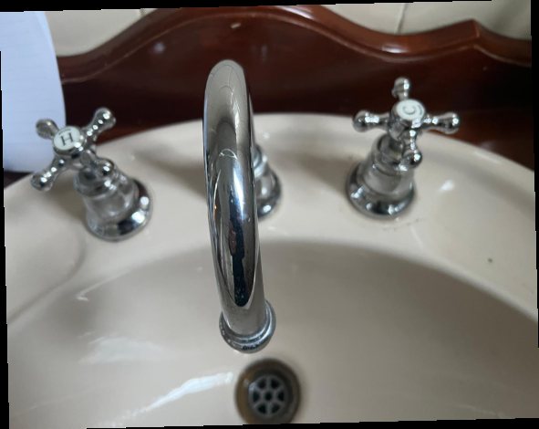 Close view of a leaking tap repair and water test