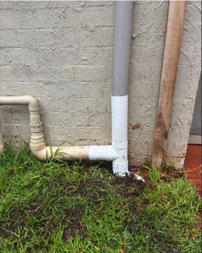 Close view of repaired 90 mm stormwater and downpipe connection in Essendon