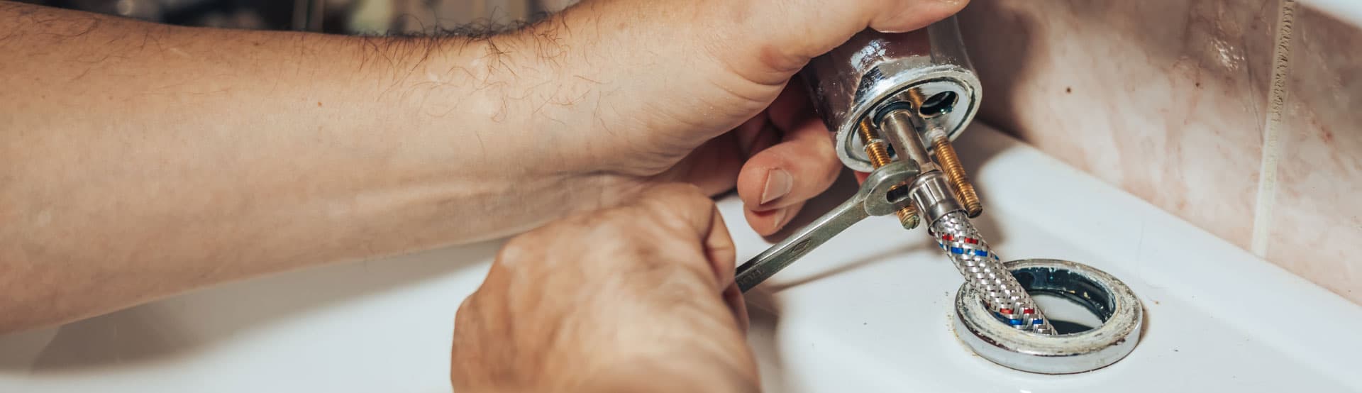 Using a spanner to disconnect a tap