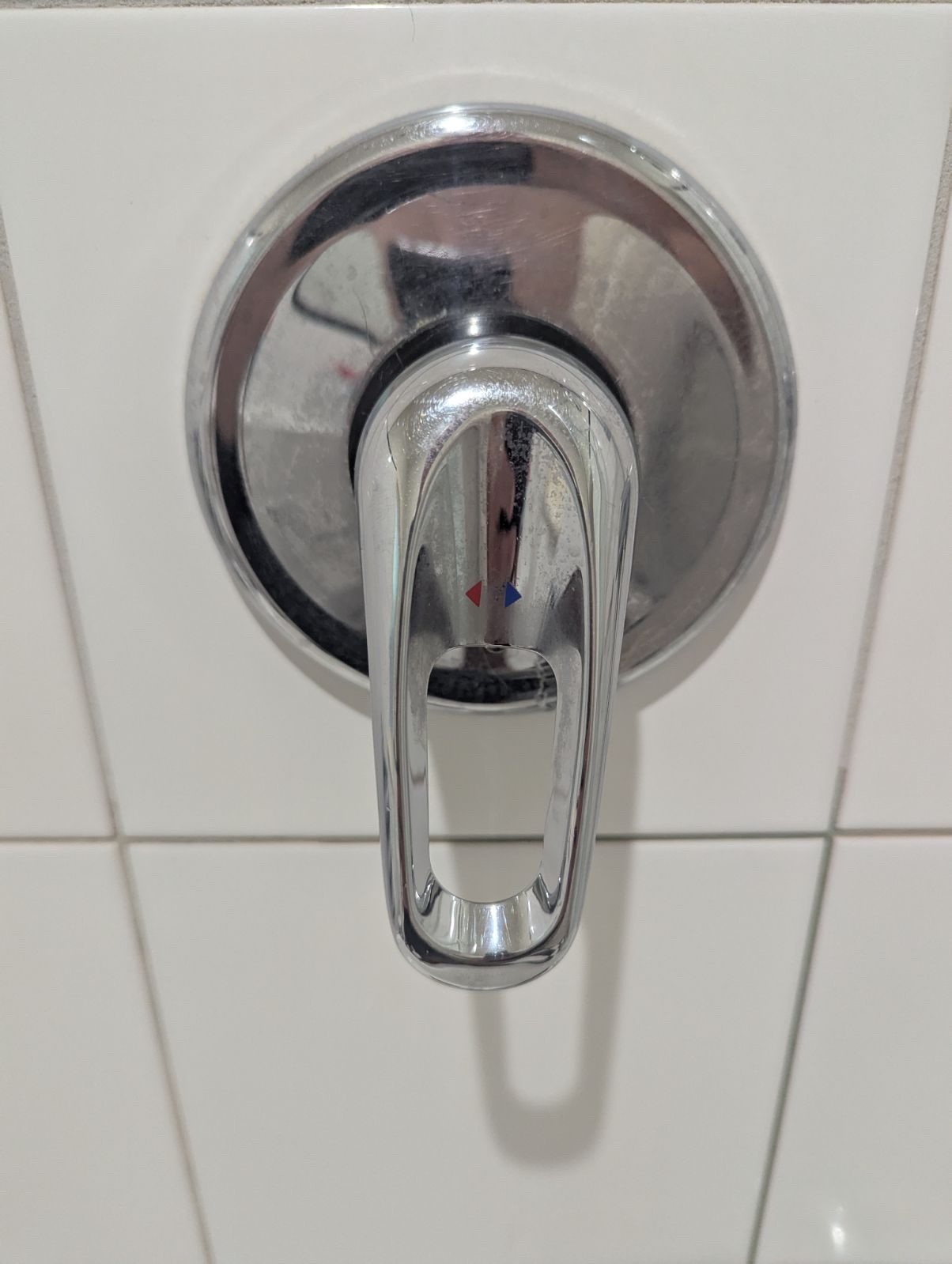 Shower-mixer body inspected before reassembly in Pascoe Vale South